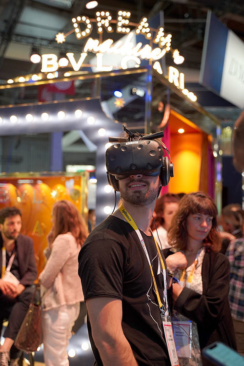 Photo of a man trying augmented reality glasses at VivaTech - Instant-delivery of visuals for trades and fairs