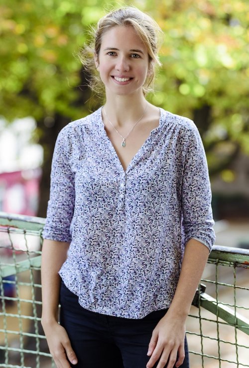 A portrait style corporate photo for the website's foundation on a natural background